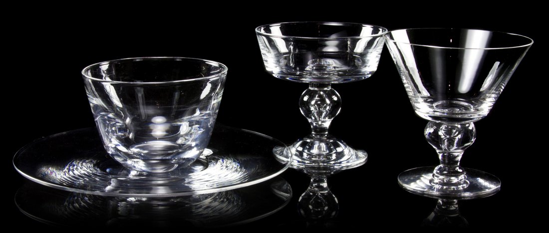 A Set of Steuben Teardrop Stemware, Diameter of p: A Set of Steuben Teardrop Stemware, comprising nine martini glasses, six sherbets, eight plates and eight finger bowls; 31 items total. Diameter of plates 8 1/2 inches. Property from the Collection of