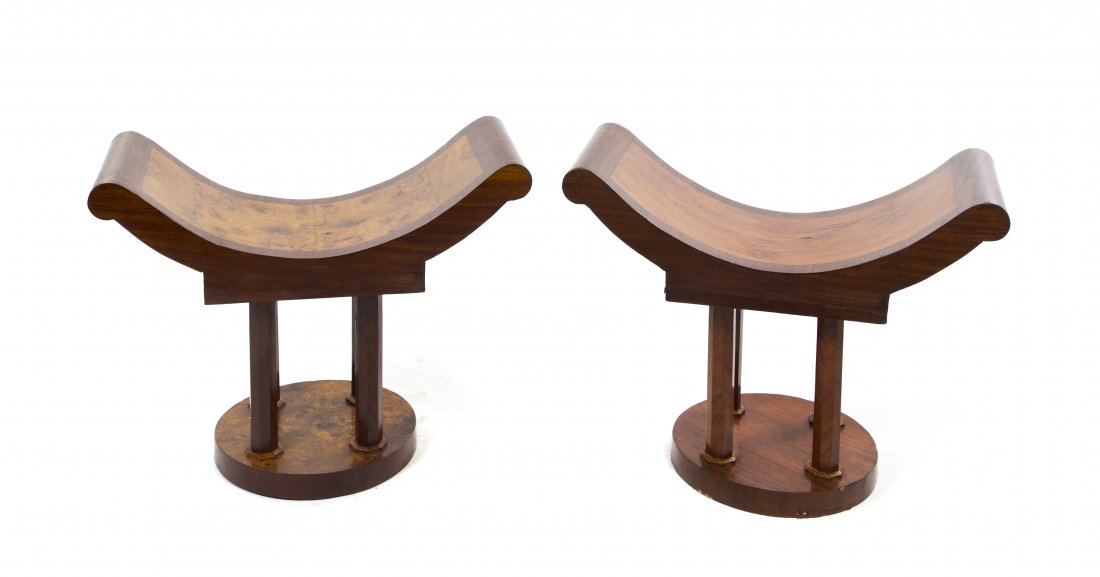 A Pair of French Art Deco Mahogany and Burl Walnu: A Pair of French Art Deco Mahogany and Burl Walnut Tabourets, attributed to Jules Leleu (1883-1961), each with a curule form seat raised on four supports over a circular base. Height 24 x width 31 x d