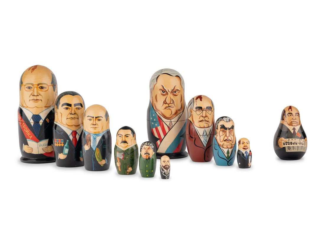 A Set of Painted Nesting Dolls of Soviet Political Leaders: A Set of Painted Nesting Dolls of Soviet Political Leaders Height of tallest 7 3/4 inches.