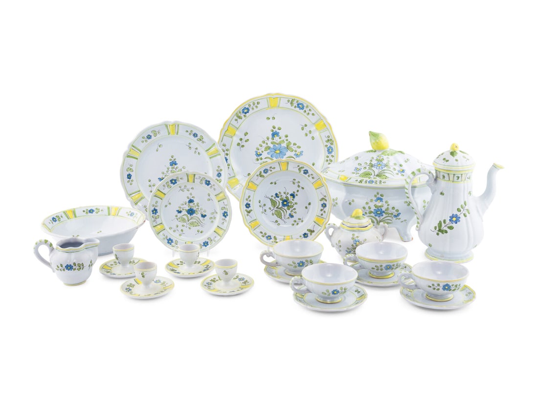 An Italian Faience Dinner Service: An Italian Faience Dinner Service comprising: 8 dinner plates 8 salad plates 8 soup bowls 1 coffee pot 8 coffee cups 7 saucers 4 egg cups 1 tureen 1 serving platter 1 serving bowl 47 items total. Diam