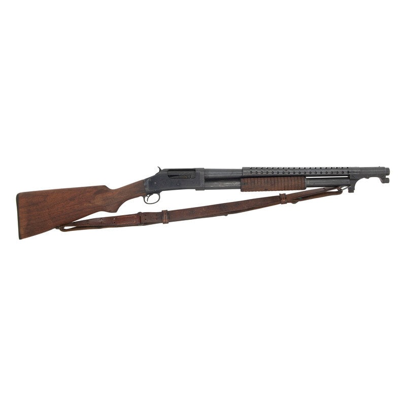 **Post-WWI Winchester Model 1897 Trench Configuration Gun: **Post-WWI Winchester Model 1897 Trench Configuration Gun World War I 12 Gauge. 20.375" barrel length. SN: E682721. 2.75" chamber length. Cylinder choke. Blued metal finish overall set in a walnut sem