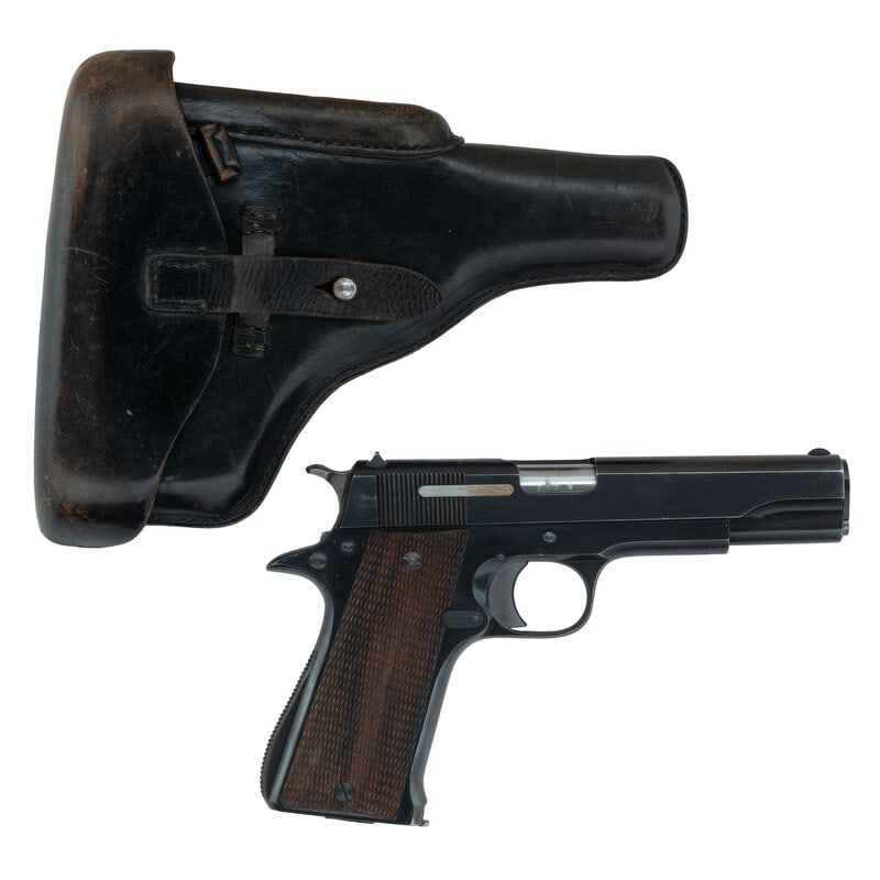**Star Model B with Police Marked Holster: **Star Model B with Police Marked Holster World War II 9mm Para. 4.8" barrel length. SN: 481219. Blued metal finish overall with straw colored small parts mounting checkered walnut stocks and military
