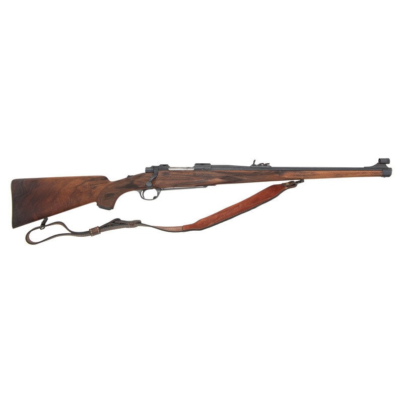*Ruger, Model 77, Mannlicher: *Ruger, Model 77, Mannlicher 250 Savage. 20" barrel length. SN: 71-02847. Blued metal finish with polished bolt, jeweled follower, and set in a walnut Mannlicher style stock with cheek rest to left si