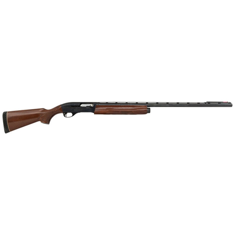 *Remington Model 1100 Magnum 12 Gauge: *Remington Model 1100 Magnum 12 Gauge 12 Gauge. 30" barrel length. SN: M758610M. 3" chamber length. Full choke. Blued metal finish with full length vented barrel rib set in a walnut semi-pistol grip s