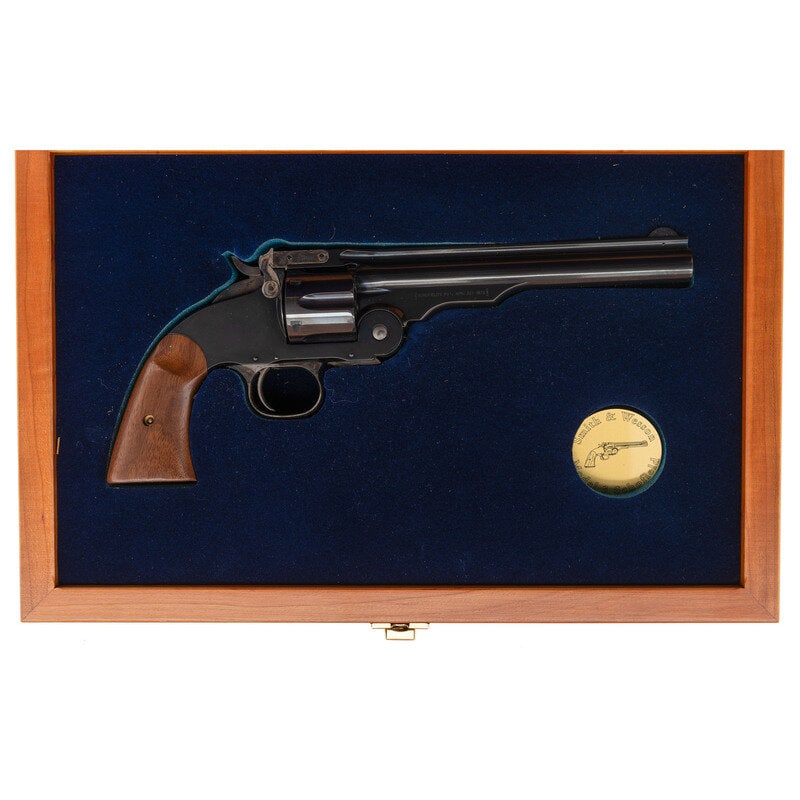 *Smith & Wesson Schofield Model of 2000 Reissue Performance Center Revolver in Factory Case: *Smith & Wesson Schofield Model of 2000 Reissue Performance Center Revolver in Factory Case .45 S&W Schofield. 7" ribbed barrel. SN: GWS0644. Blued and color casehardened finish, smooth two-pi