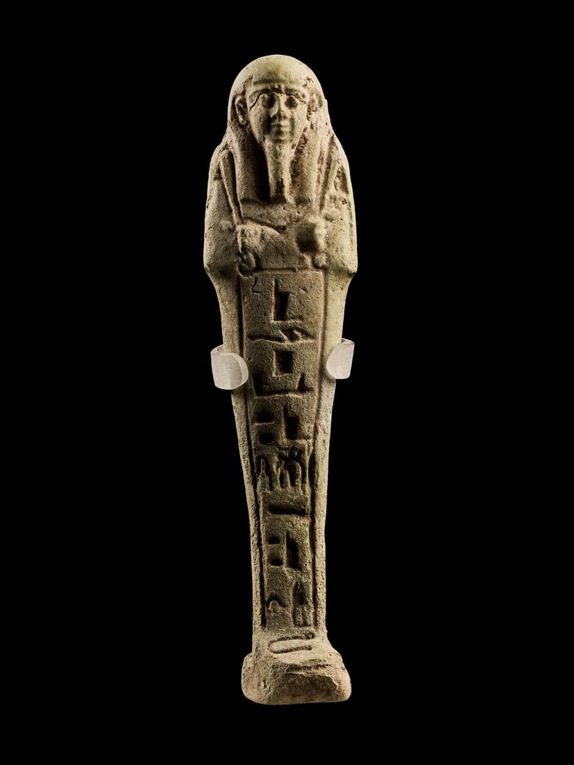 An Egyptian Faience Ushabti for Pa-Di-Aset: An Egyptian Faience Ushabti for Pa-Di-Aset Late Period, 26th Dynasty, 664-525 B.C. Height 6 inches (15.24 cm). Provenance: Donald Wonder (1938-2023), California & New Jersey, prior to 2003; thence by 
