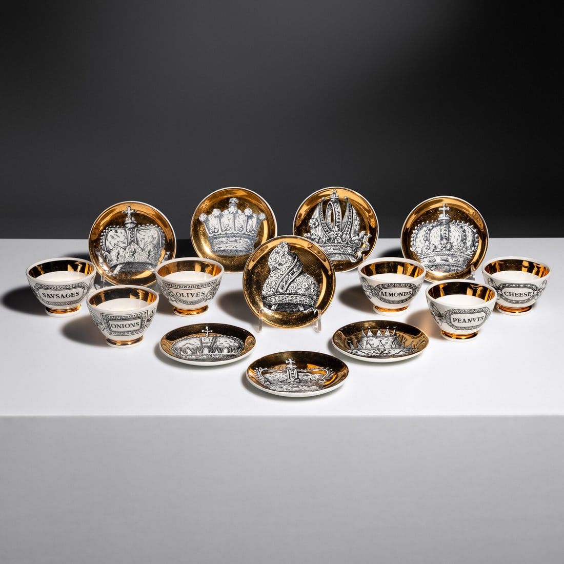 Piero Fornasetti (Italian, 1913-1988) Collection of Porcelain Articles Fornasetti, Italy: Piero Fornasetti (Italian, 1913-1988) Collection of Porcelain Articles Fornasetti, Italy lithographically-decorated and gilt porcelain with printed retailer’s label Fornasetti, Milano, Made in I