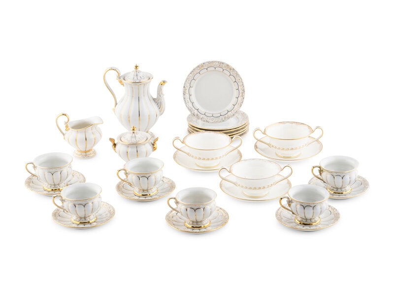 A Meissen Porcelain Coffee Service: A Meissen Porcelain Coffee Service 20th Century comprising: 1 coffee pot 1 two-handled sugar bowl 1 cream jug 6 coffee cups 6 saucers, together with 9 associated saucers (of varying size