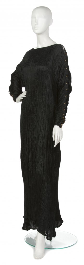A Mariano Fortuny Black Silk Delphos Gown,: A Mariano Fortuny Black Silk Delphos Gown, early 20th century, sleeves edged in Murano glass beads. Labeled in inner selvedge: Made in Italy Fabrique en Italie Fortuny Depose. Property of a Lady, Dall