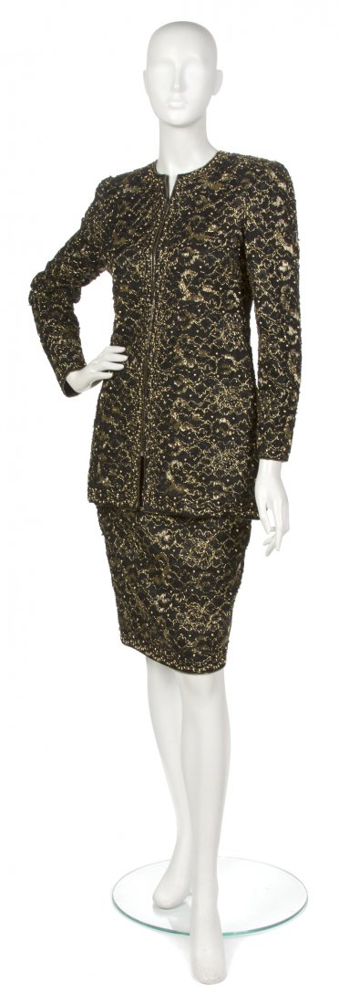 A Mary McFadden Black Lace Skirt Suit, Size 2.: A Mary McFadden Black Lace Skirt Suit, allover gold beading. Labeled: Mary McFadden Couture. Size 2. Property of an Important Collector