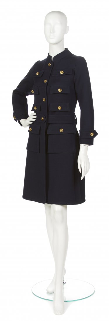 A Chanel Couture Navy Wool Coat,: A Chanel Couture Navy Wool Coat, in a military style with goldtone logo buttons. Labeled: Chanel/36637. Property from the Sally Leezenbaum Collection, Oldwick, New Jersey