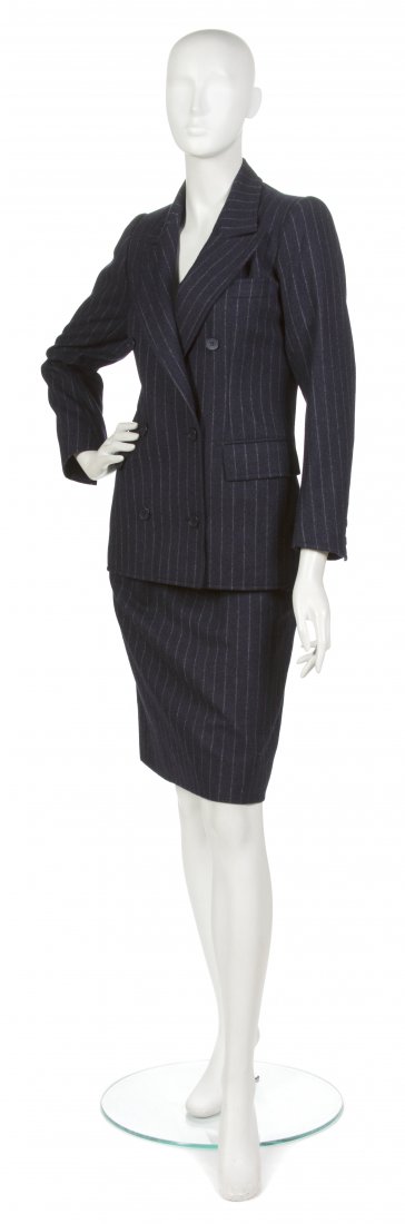 An Yves Saint Laurent Navy Wool Pinstripe Skirt Su: An Yves Saint Laurent Navy Wool Pinstripe Skirt Suit. Labeled: Saint Laurent. Size 34. Property from the Sally Leezenbaum Collection, Oldwick, New Jersey