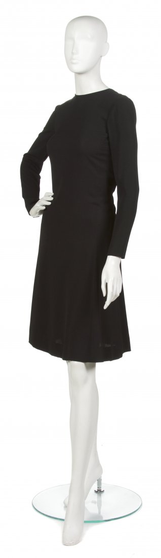 An Yves Saint Laurent Couture Black Silk Crepe Dre: An Yves Saint Laurent Couture Black Silk Crepe Dress, raglan sleeves, tie at neck, lined in silk. Labeled: Yves Saint Laurent/25857. Property from the Sally Leezenbaum Collection, Oldwick, New Jersey