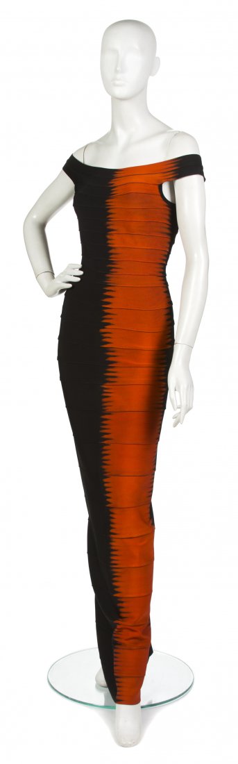 An Herve Leger Couture Flame Bondage Evening Gown,: An Herve Leger Couture Flame Bondage Evening Gown, black with a vertical stripe of orange in a flame motif. Labeled: Herve Leger Couture. Size M. Property from a New York City Collection