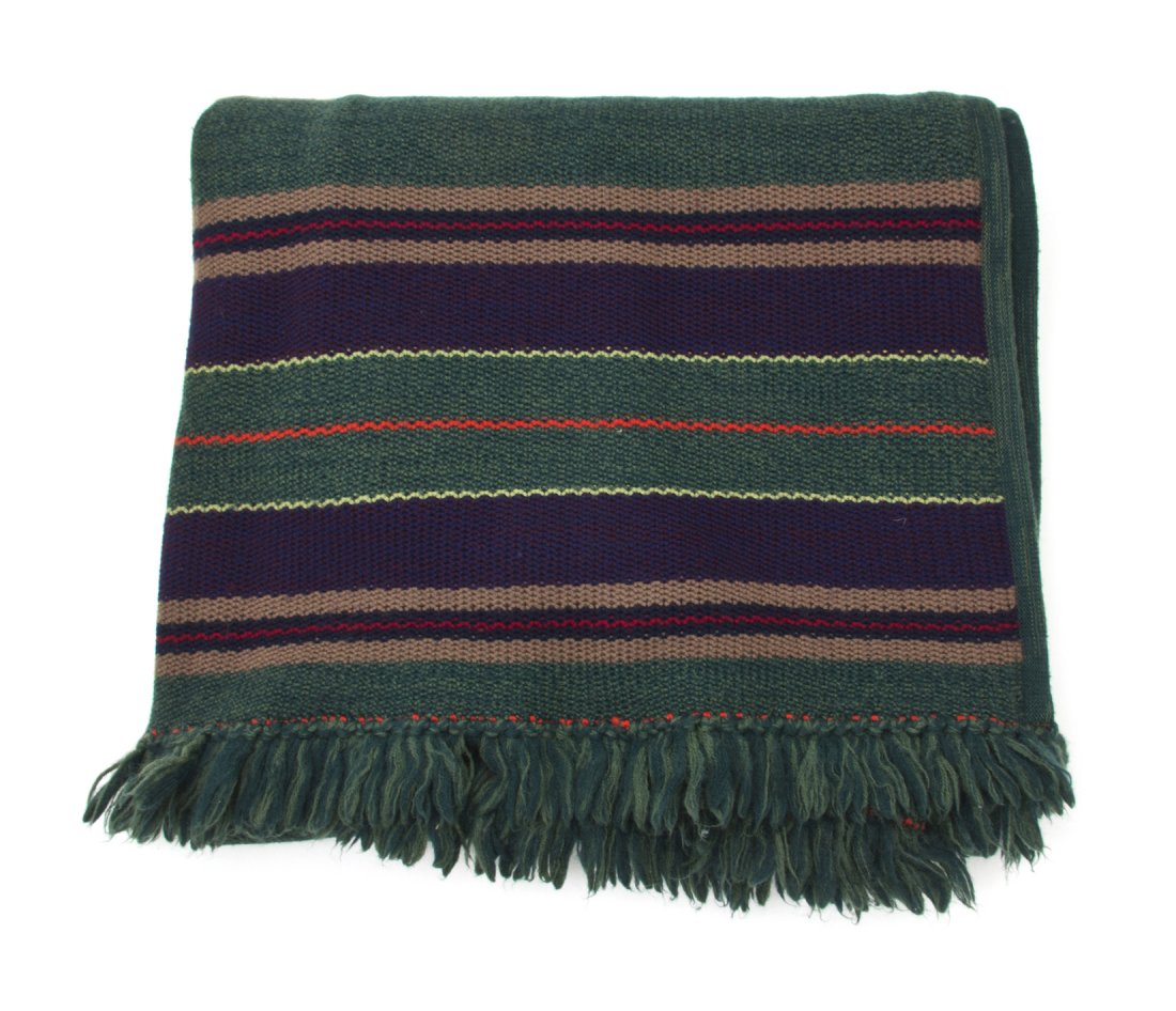 An Yves Saint Laurent Multicolor Wool Knit Shawl. : An Yves Saint Laurent Multicolor Wool Knit Shawl. Labeled: Saint Laurent. 114 x 41 inches.
