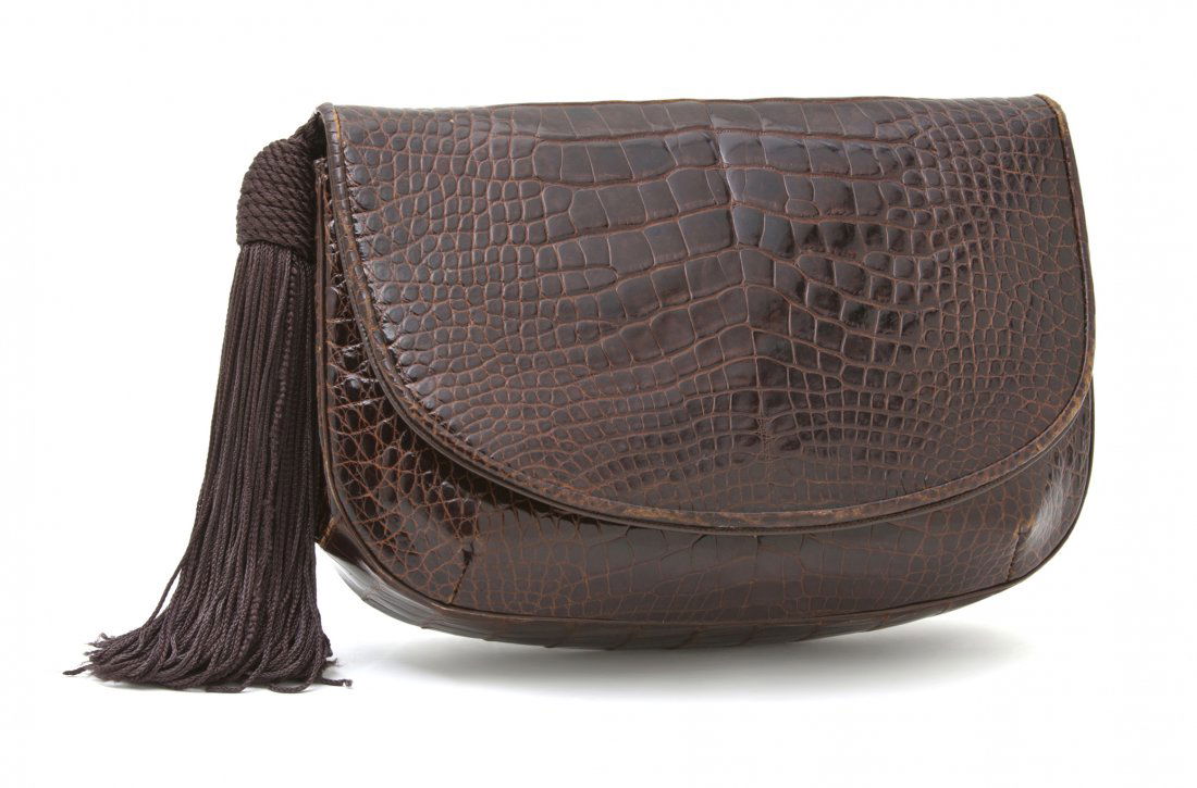 A Judith Leiber Brown Alligator Bag, 9 x 6 1/2 x 2: A Judith Leiber Brown Alligator Bag, brown tassel and detachable alligator shoulder strap. Labeled: Judith Leiber. 9 x 6 1/2 x 2 inches.