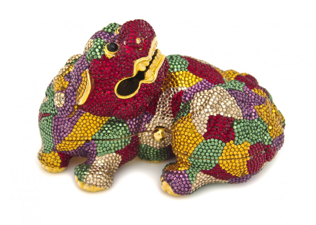 A Judith Leiber Multicolor Crystal Stained Glass F: A Judith Leiber Multicolor Crystal Stained Glass Fu Dog Minaudiere, gold, amber, red, purple and green crystals with black cabochon eyes with all accesories. Stamped: Judith Leiber.