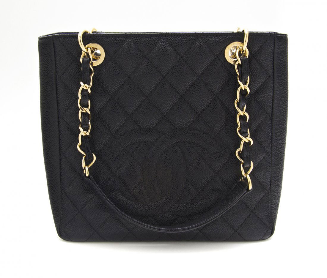 A Chanel Black Quilted Caviar Leather Bag, 10 x 9: A Chanel Black Quilted Caviar Leather Bag, goldtone chain double shoulder straps, snap closure, exterior logo applique on one side with exterior pocket on the other. Stamped: Chanel. 10 x 9 1/2 x 3 in