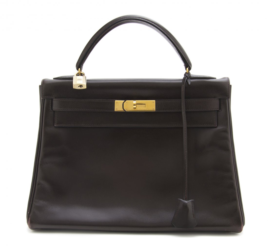 An Hermes Brown Leather Kelly Bag, 32 x 22 x 12 cm: An Hermes Brown Leather Kelly Bag, 1991, with goldtone hardware, lock and key sheath, blindstamp U. Stamped: S/Hermes. 32 x 22 x 12 cm (12 1/2 x 9 x 5 inches).
