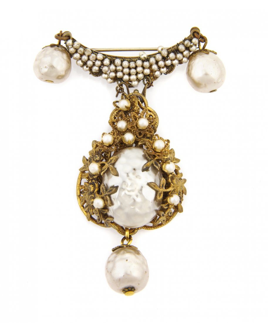A Miriam Haskell Pearl Brooch,: A Miriam Haskell Pearl Brooch, with openwork scrolling designs. Stamped: Miriam Haskell.