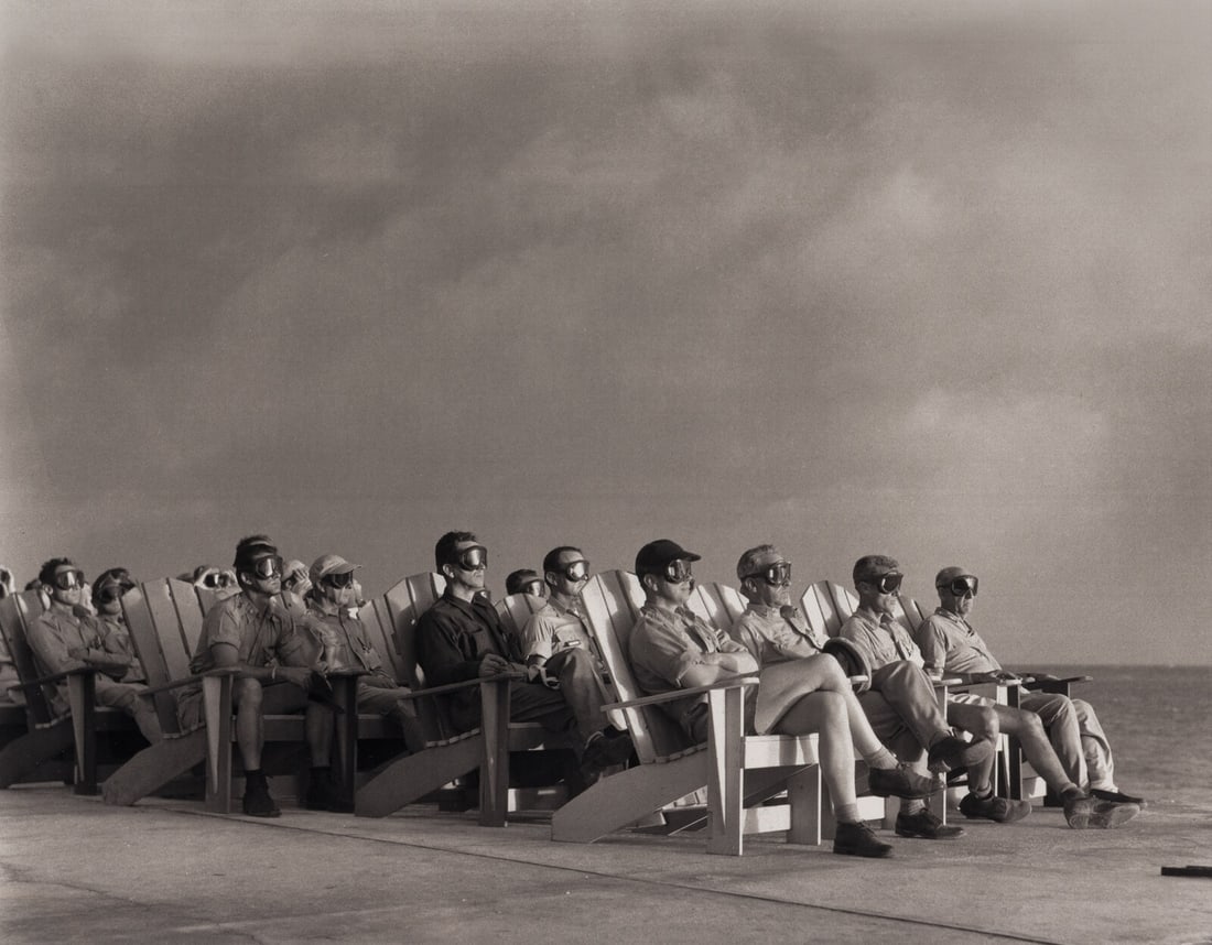 [OPERATION GREENHOUSE - DOG TEST]. Photograph of VIP observers lit up by the light of an atomic bomb (1 of 4)