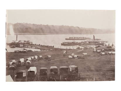 [CIVIL WAR]. Possibly by Timothy H. O'SULLIVAN (1840-1882), or James GARDNER (b. 1832),: [CIVIL WAR]. Possibly by Timothy H. O'SULLIVAN (1840-1882), or James GARDNER (b. 1832), photographers. Upper Wharf with Wagon Park, Belle Plain, Virginia. 1864. 5 5/16 x 8 1/8 in. albumen print