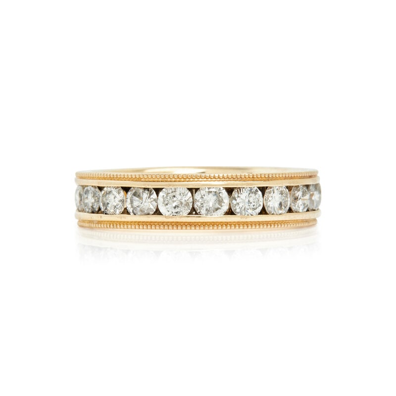 YELLOW GOLD AND DIAMOND BAND RING: YELLOW GOLD AND DIAMOND BAND RING Round brilliant cut diamonds weighing approximately 1.00 carat total. 14 karat yellow gold. Ring size 7. Stamp: 14K JST. Gross weight: 3.50 dwt. This lot