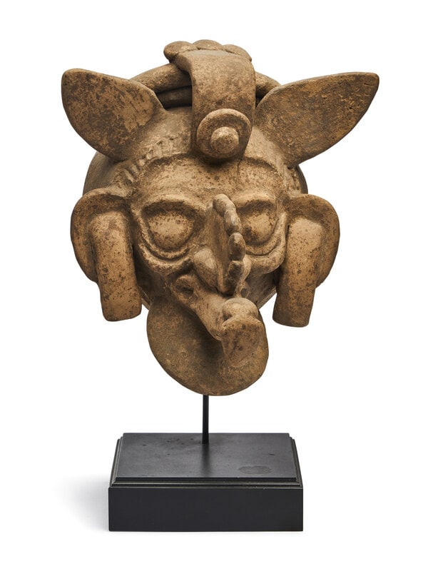 A Maya Polychrome Terracotta Head of a Deity: A Maya Polychrome Terracotta Head of a Deity Circa 600-900 A.D. Height 7 x width 6 inches. This lot is located in Chicago.
