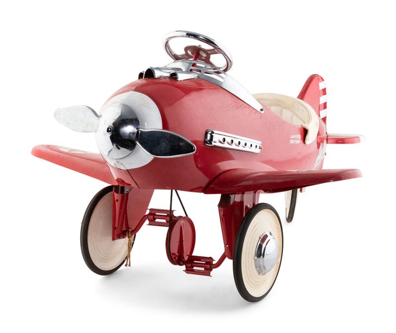 An Air Knight Special Edition Pedal Airplane : An Air Knight Special Edition Pedal Airplane Circa 1930s with red body and wings, white propeller, and chrome steering wheel. Height 27 x length 47 inches. This lot is located in