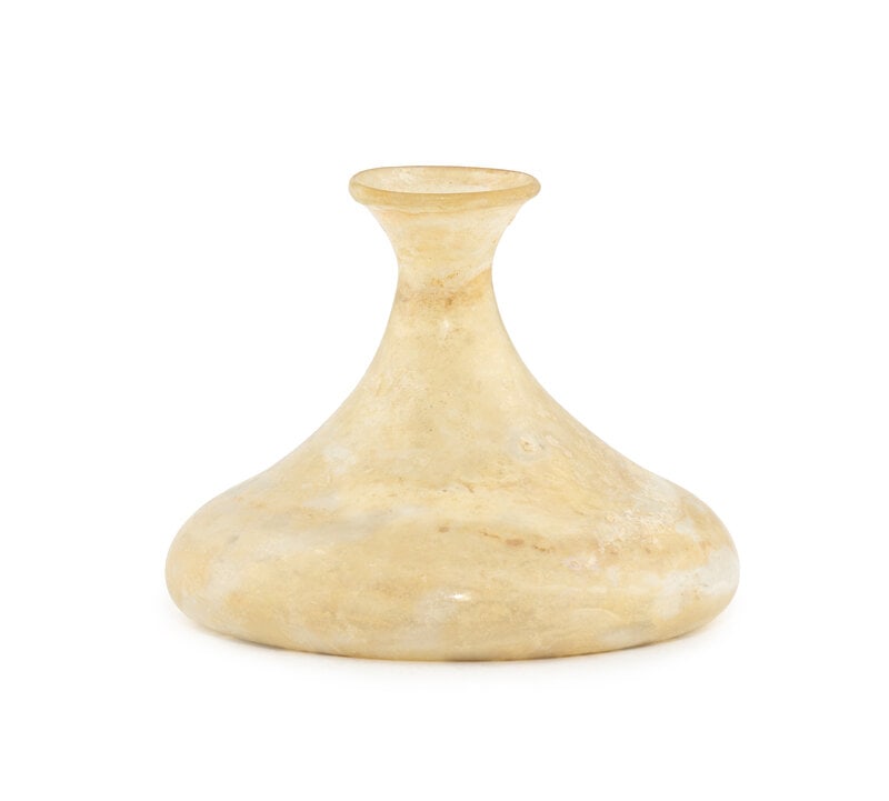 A Roman Glass Bottle: A Roman Glass Bottle Circa 1st-3rd Century A.D. Height 4 3/4 x width 5 3/4 inches. This lot is located in Chicago.
