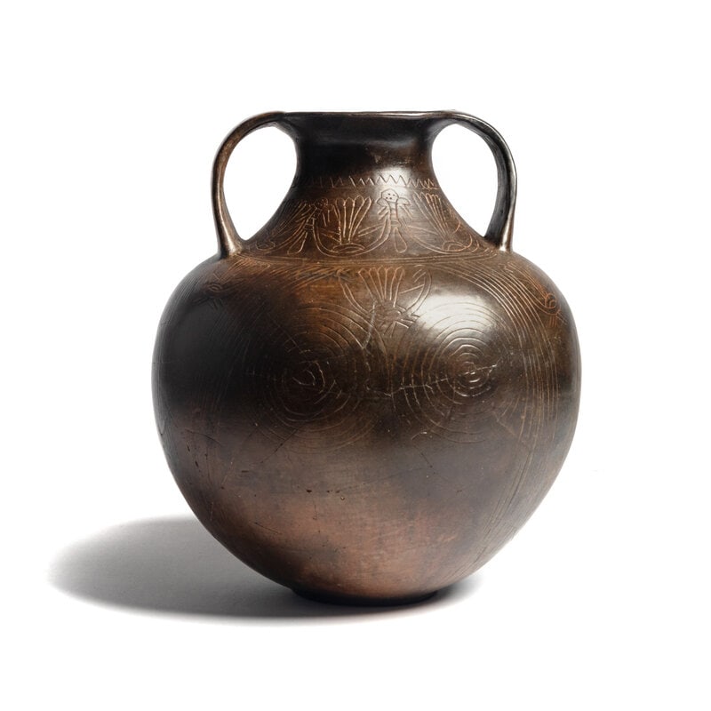 A Villanovan Impasto Amphora: A Villanovan Impasto Amphora Circa 8th-7th Century B.C. Height 11 x diameter 9 1/4 inches. Condition Note: Shows signs of possible repair in body/cracks and pieces h