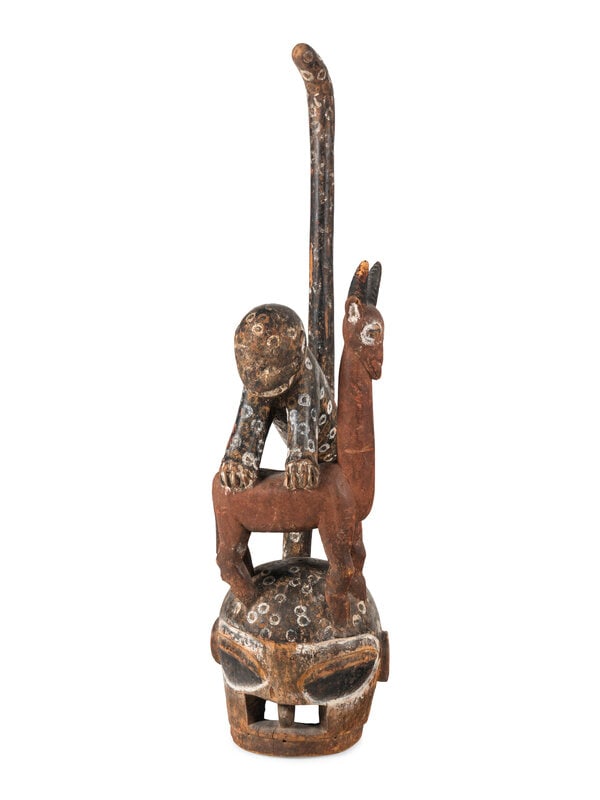 An African Carved and Painted Wood Monkey and Gazelle Figural Group : An African Carved and Painted Wood Monkey and Gazelle Figural Group 20th Century Height 57 inches. This lot is located in Chicago. Condition Has separate base