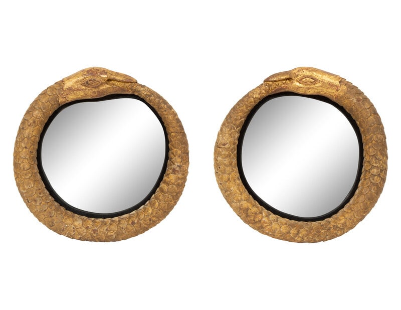 A Pair of Giltwood Snake Motif Mirrors: A Pair of Giltwood Snake Motif Mirrors Diameter 12 inches. Property from the Collection of William L. Bernhard and Catherine Cahill, Southampton, New York Provenance