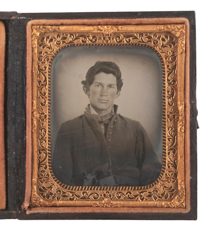 [CIVIL WAR]. Sixth plate ruby ambrotype of an armed cavalryman.  (1 of 1)