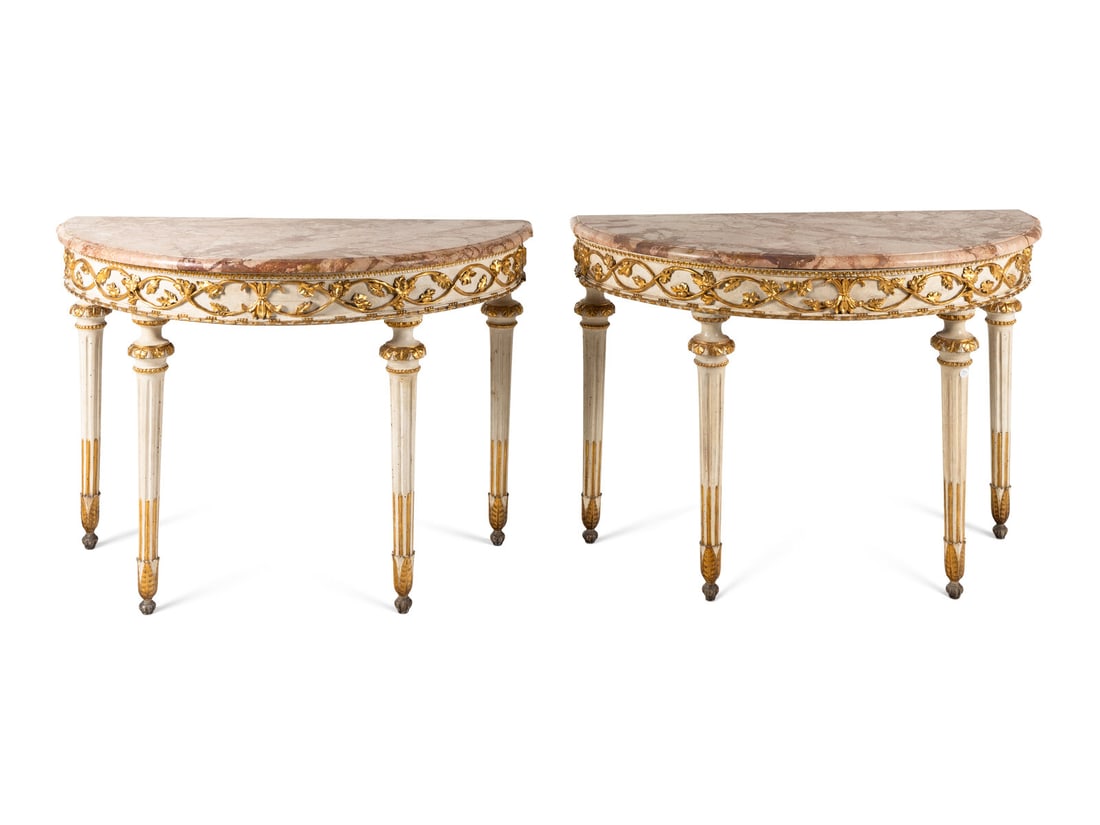 A Pair of North European Painted and Parcel-Gilt Console Tables: A Pair of North European Painted and Parcel-Gilt Console Tables 19th Century Height 35 1/2 x width 50 x depth 26 1/2 inches. This lot is located in Chicago.