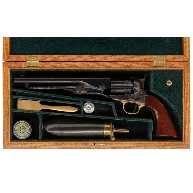 Cased Uberti Reproduction Colt Model 1860 Army Revolver with Accessories: Cased Uberti Reproduction Colt Model 1860 Army Revolver with Accessories .44 caliber. 8" barrel. SN: D41184. Blued and color casehardened finish, brass triggerguard, varnished hardwood grip. Single ac