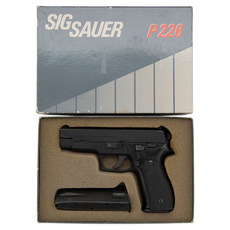 *Sig Sauer P226 in Box with Accessories: *Sig Sauer P226 in Box with Accessories 9mm Para. 4.4" barrel length. SN: U429822. Black Nitron finish with black hard anodized frame mounting checkered black synthetic grip panels. DA/SA short recoil
