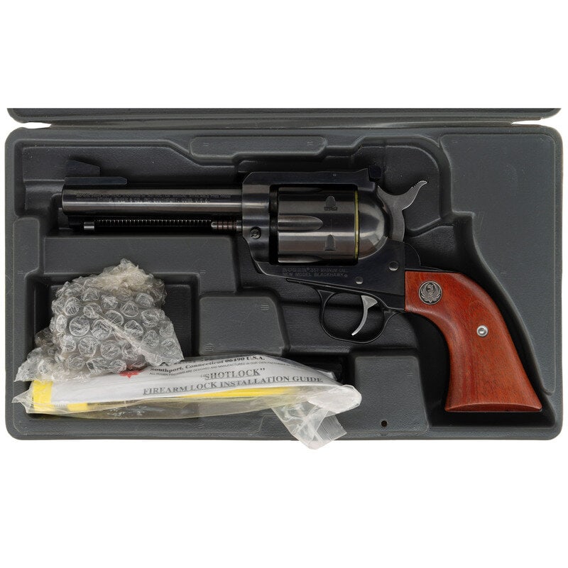 *Ruger New Model Blackhawk .357 Magnum/9mm Dual Cylinder Revolver in Box: *Ruger New Model Blackhawk .357 Magnum/9mm Dual Cylinder Revolver in Box .357 Magnum & 9mm. 4.75" barrel. SN: 37-80659. Blued finish, Ruger medallion hardwood grips. Single action solid frame revo