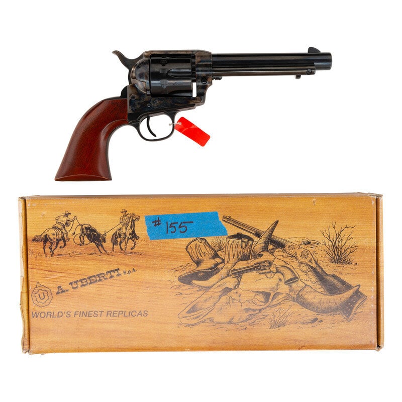 *Uberti 1873 Cattleman .22RF in Box: *Uberti 1873 Cattleman .22RF in Box .22LR. 5.5" barrel. SN: UF0913. Blued and color casehardened finish, smooth hardwood grips. Single action "smokeless powder" frame replica single action arm revolve