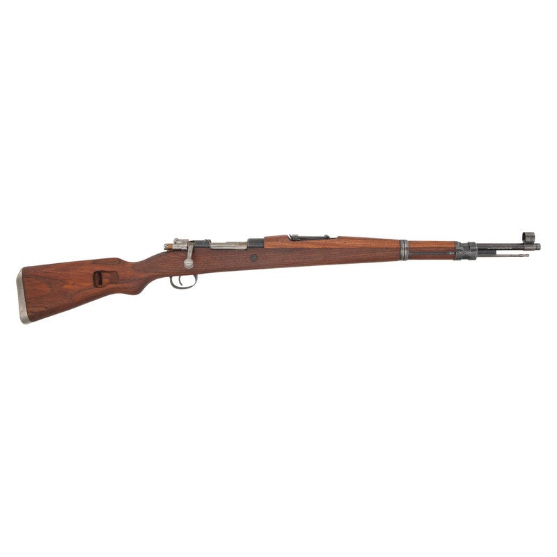 **Yugoslavian Zastava M48 Mauser: **Yugoslavian Zastava M48 Mauser 7.92x57mm Mauser. 24" barrel length. SN: M82805. Blued military finish and polished steel bolt. Walnut stock has a plain semi pistol grip and forearm, with handguard.