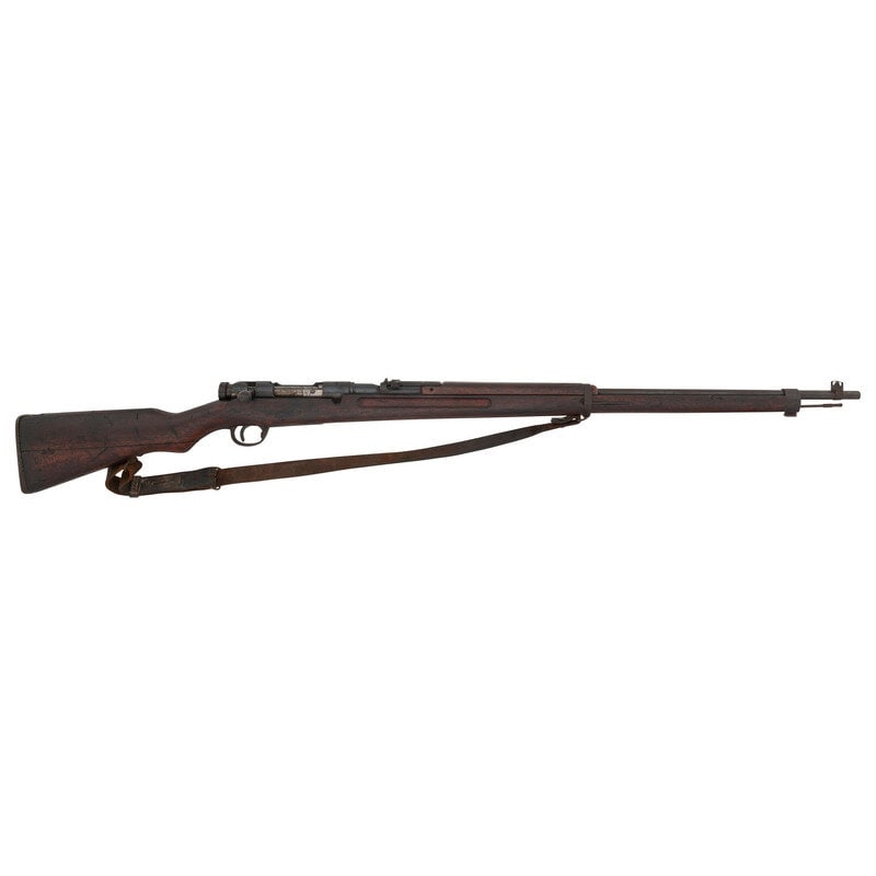 **Arisaka Type 38 Rifle: **Arisaka Type 38 Rifle 6.5x50SR Arisaka. 31" barrel length. SN: 48139. Blued military finish. Hardwood stock has a plain semi pistol grip and forearm, with handguard and grasping grooves. Bolt action