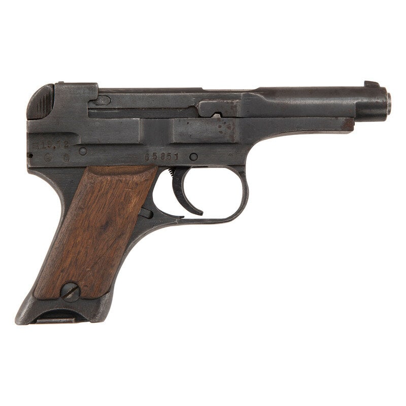 **Japanese Nambu Type 94 Pistol: **Japanese Nambu Type 94 Pistol 8mm Nambu. 3.75" barrel. SN: 65851. Blued finish, smooth Asian hardwood grips. Short recoil operated fixed barrel detachable magazine semiautomatic pistol with fixed no