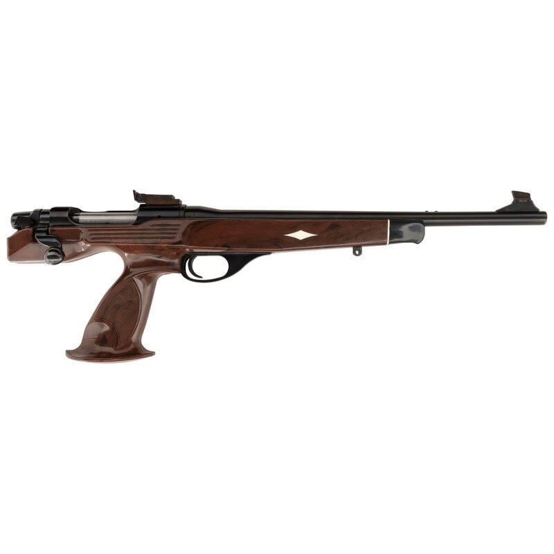 *Remington XP-100 7mm BR: *Remington XP-100 7mm BR 7mm BR. 15" barrel length. SN: B7526224. Blued metal finish with polished bolt set in a brown synthetic stock with white synthetic Diamond inserts and black forend cap. Single