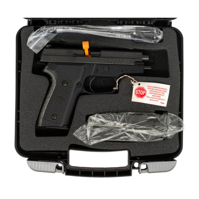*Sig Sauer P229 Elite 9mm Pistol in Box with Accessories: *Sig Sauer P229 Elite 9mm Pistol in Box with Accessories 9mm Para. 3.8" barrel length. SN: 55E013403. Black Nitron finish with black anodized frame mounting black and white G10 SIG logo grips and trip