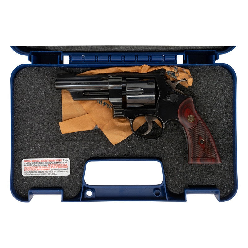 *Smith & Wesson 27-9 .357 Magnum Revolver: *Smith & Wesson 27-9 .357 Magnum Revolver .357 Magnum. 4" ribbed barrel. SN: CZL9548. Blued finish, color casehardened trigger and hammer, checkered S&W medallion hardwood grips. Double action
