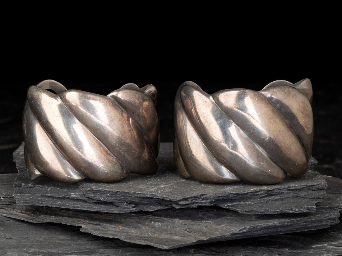 Margot de Taxco (American-born, d. 1985) Matching Pair of Taxco Sterling Silver Cuff Bracelets,: Margot de Taxco (American-born, d. 1985) Matching Pair of Taxco Sterling Silver Cuff Bracelets, 1948-1978 lot of 2, both marked MARGOT DE TAXCO MADE IN MEXICO STERLING 5192 with an Eagle 16 hallmark,