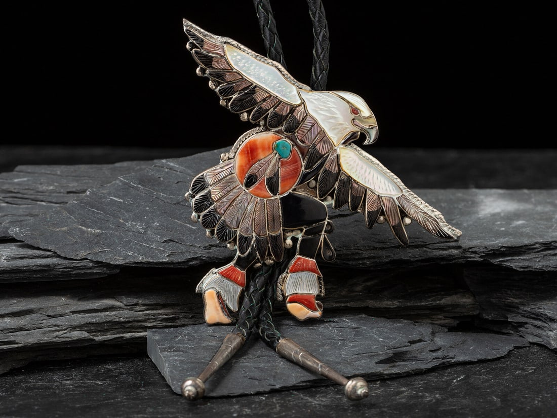 Virgil and Shirley Benn (Zuni, act. since 1950s) / (Tewa, b. 1936) Mosaic Inlay Eagle Dancer Bolo (1 of 2)