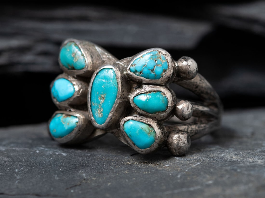 Men's Navajo Ingot and Turquoise Cluster Ring, Collected by Hoffman Birney (1891-1958): Men's Navajo Ingot and Turquoise Cluster Ring, Collected by Hoffman Birney (1891-1958) ca 1900 split shank set with seven turquoise stones forming a butterfly cluster size 11.5, weight 11.3 dwt. This