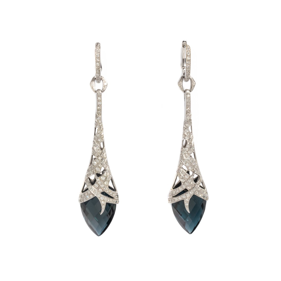 STEPHEN WEBSTER, WHITE GOLD, BLUE TOPAZ, AND DIAMOND 'THORN' EARRINGS: STEPHEN WEBSTER, WHITE GOLD, BLUE TOPAZ, AND DIAMOND 'THORN' EARRINGS Pear shaped faceted blue topaz drops measuring approximately 17.00 x 12.10 x 6.70 mm and 17.00 x 12.10 x 7.00 mm and round brillia