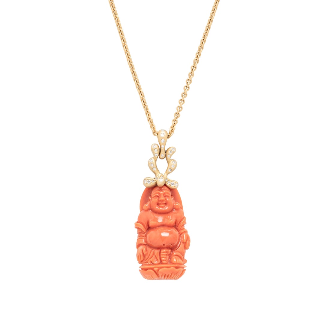 DONALD HUBER, CORAL AND DIAMOND BUDDHA PENDANT/NECKLACE: DONALD HUBER, CORAL AND DIAMOND BUDDHA PENDANT/NECKLACE Pendant by Donald Huber containing a carved coral Buddha and round brilliant cut diamonds, suspended by a cable link chain. 18 karat gold. Penda